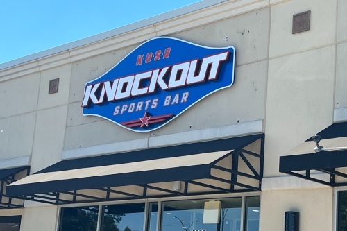 sign on building for Knockout Sports Bar