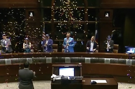 confetti in air at city council meeting