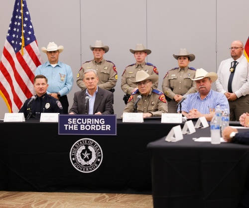 Texas Gov. Greg Abbott and other state officials at a news conference in Midland, TX, on Sept. 21. A sign on the table reads "SECURING THE BORDER."