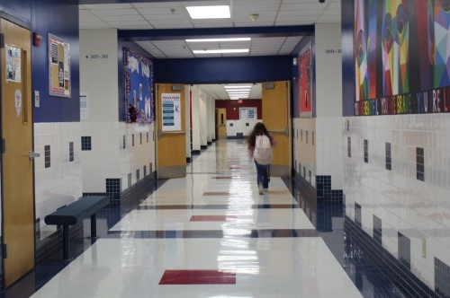 student walking down hallway