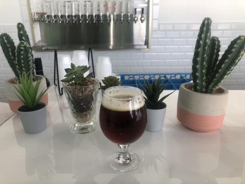 A 10 ounce glass with a rounded bowl on a small stem offers variety to sample multiple pours and helps to capture the aroma of the beer. In this glass, Mendez poured Mandatory Fun, an amber ale. (Photos by Asia Armour/Community Impact Newspaper)