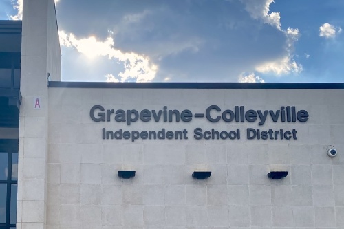 building with sign reading "Grapevine-Colleyville Independent School District"