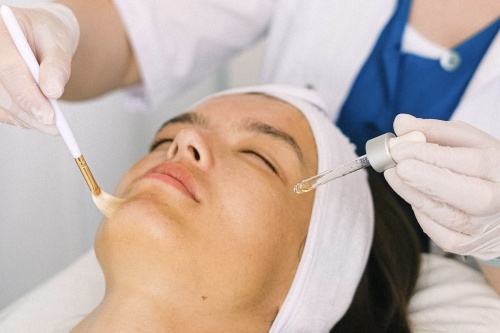 woman receiving facial treatment 