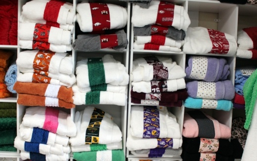 Among the popular items at Made by Sue are college spirit towel wraps with a name or monogram ($42.95). (Karen Chaney/Community Impact Newspaper)