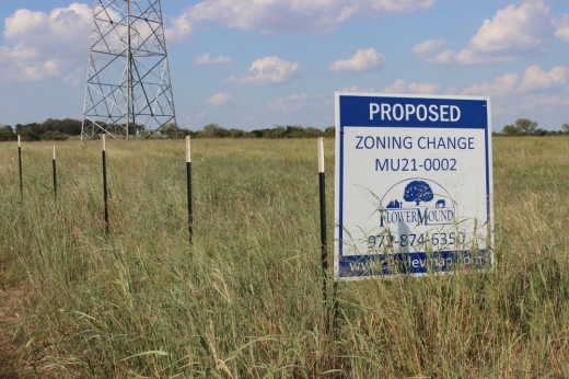 As people move westward, developments, such as the proposed Flower Mound Ranch where zoning signs map the project site, follow. (Samantha Douty/ Community Impact)