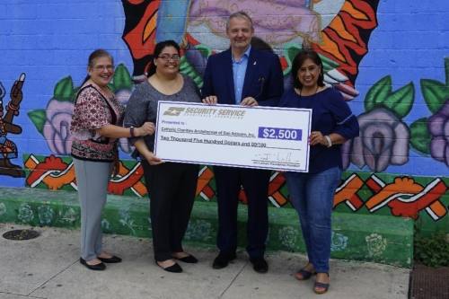 The San Antonio-based Security Service Charitable Foundation on Oct. 4 announced a $2,500 donation to Catholic Charities of San Antonio. From left are Catholic Charities Director Lydia Cardenas; Denise Ramirez, director of the Guadalupe Community Center for Catholic Charities; Catholic Charities President and CEO J. Antonio Fernandez; and Lupe Morin, Adopt-A-Senior coordinator for Catholic Charities. (Courtesy Security Service Federal Credit Union)