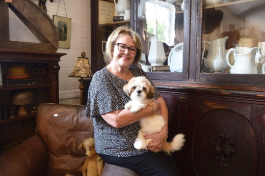 Gatherings owner Stephanie Ehrhardt with her dog Gucci opened a second Georgetown storefront in September. (Hunter Terrell/Community Impact)