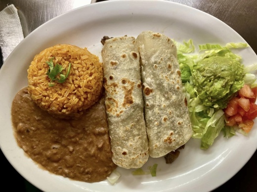 Tacos al Carbon - $16.50 2 chicken or beef fajita tacos, served with rice, beans and guacamole, from the lunch menu. (Photos by Daniel Weeks/Community Impact)
