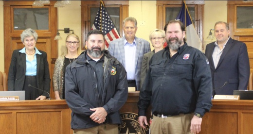 Seven people posing for a picture