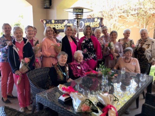 Group of women gathered around a table.