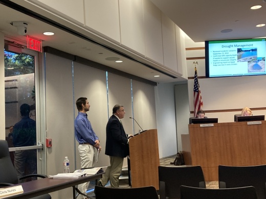 Chris Nunes, chief operating officer in The Woodlands Township (right) discusses options for filling several township ponds. Adam Vento, an engineer with Bleyl Engineering, presented a study on the proposal Oct. 20. (Vanessa Holt/Community Impact)