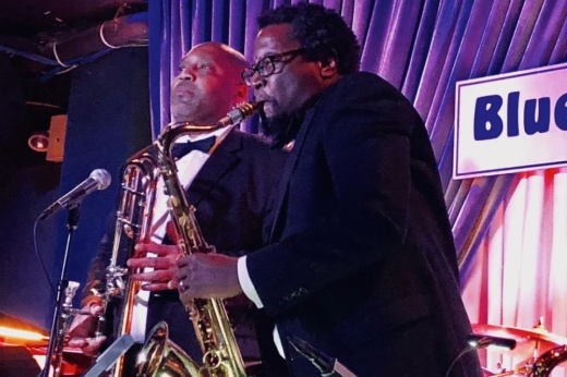A jazz saxophonist perfoms.