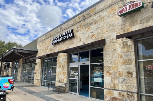 Outside of a single story retail building.