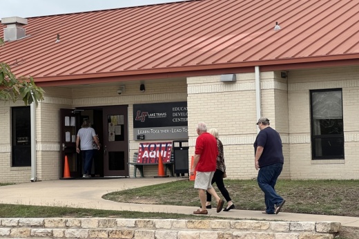 people walking into polling location