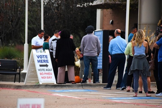 Voters standing in line.