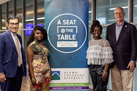 UTSA student Nia Houston (right center) and her mother Naana Butler (left center) pose with Alamo Colleges District Chancellor Mike Flores (far left) and UTSA President Taylor Eighmy during a Nov. 9 event announcing the Promise-to-Promise partnership, which permits ACD students to transfer to UTSA to complete a four-year degree with all educational costs covered. (Courtesy Alamo Colleges District)