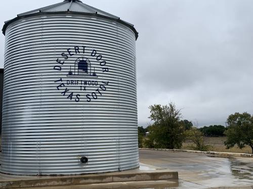 Desert Door Distillery has a 33,000-gallon water tank on-site that catches rainwater and is then used to cool equipment. (Amanda Cutshall/Community Impact)
