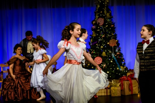 children dancing on christmas-themed stage