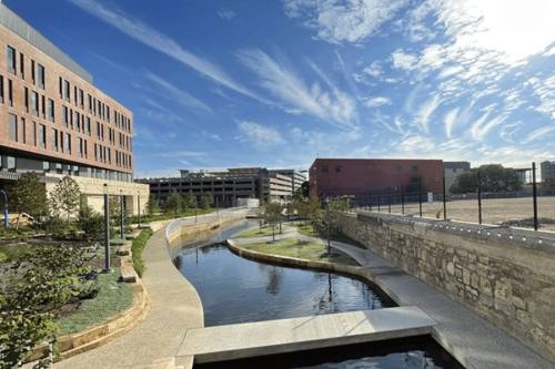 The new San Pedro Creek extension weaves a path between UTSA's San Pedro I development (left) and the site where San Pedro II will be built (right). (Courtesy The University of Texas at San Antonio)