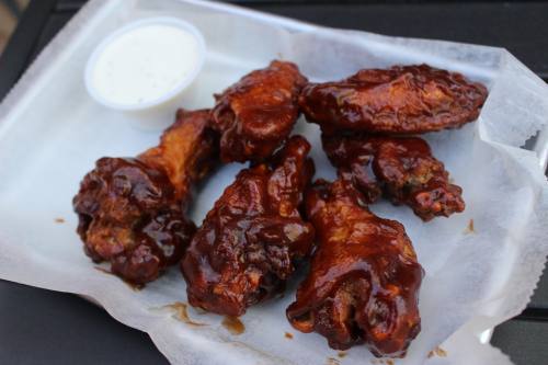 BBQ Wings ($10.95) is a popular appetizer that comes naked, or with hot or sweet and chili flavors. (Peyton MacKenzie/Community Impact)