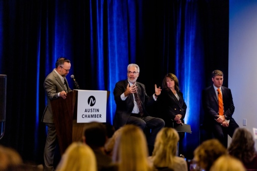 Four people on stage.