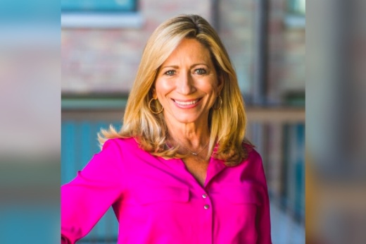 A woman in a pink blouse