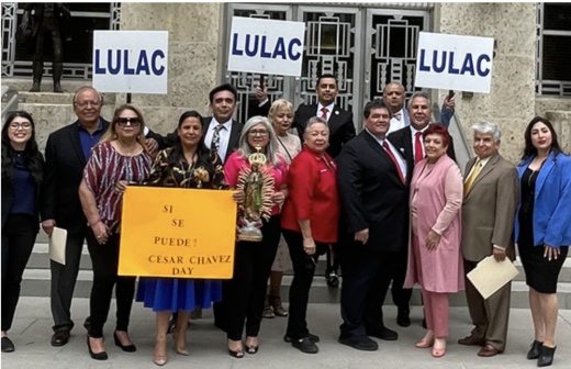 LULAC members protest outside of Houston City Hall.