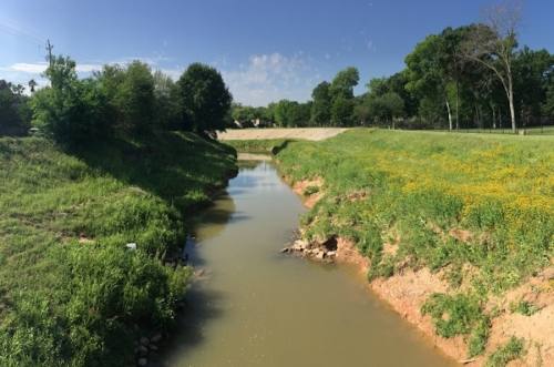 An effort to improve channel conveyance on a 15-mile stretch of White Oak Bayou will resume in early 2023. (Shawn Arrajj/Community Impact)