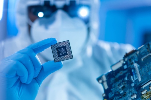 person holding semiconductor chip