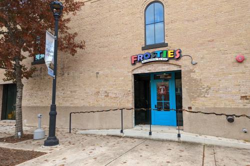 Photo of the front door and sign outside Frosties