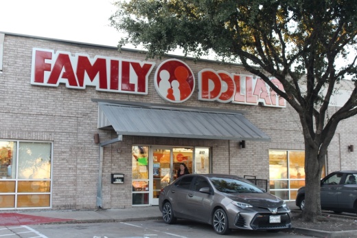 Store front of a Family Dollar store in McKinney, Texas with a car in a parking spot.
