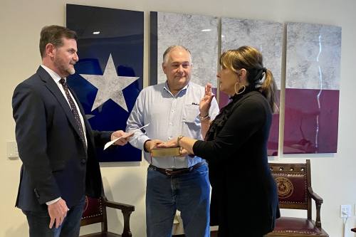 Texas Sen. Brandon Creighton (left) swears in Rebecca Broussard to the Lone Star College System board of trustees. (Courtesy Lone Star College)