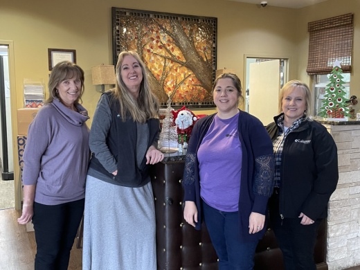 From left: Administrative Assistant Kat Grady and Manager Dallas Gorman work alongside Senior Administrative Assistant Alisha Osborne and Parks & Recreation Director Andra Bennett on programming. (Taylor Cripe/Community Impact)