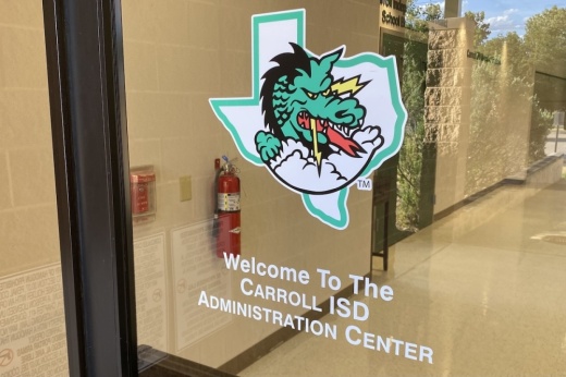 door with sign of texas and a dragon