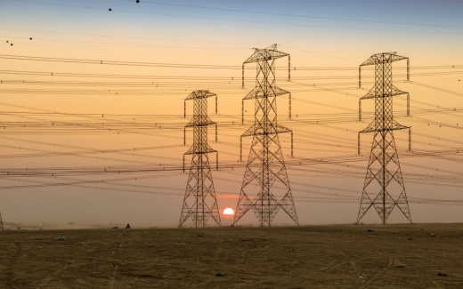 Power lines against a sunset