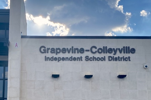 outside of building with sign that says Grapevine-Colleyville Independent School District