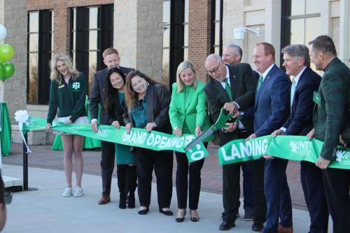 UNT President Neal Smatresk cuts the ribbon to open the new Frisco Landing campus before classes begin Jan. 17. (Alex Reece/Community Impact)