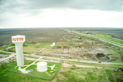 drone shot of hutto megasite next to water tower