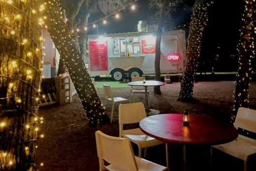 A nighttime photo of the food truck