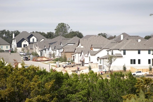 drone shot of neighborhood in georgetown with all white houses and grey roofs