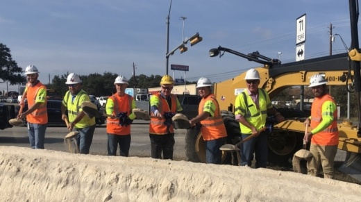 groundbreaking photo of people in construction gear with shovels