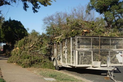 A trailer is overflowing with storm debris in South Central Austin. (Katy McAfee/Community Impact)