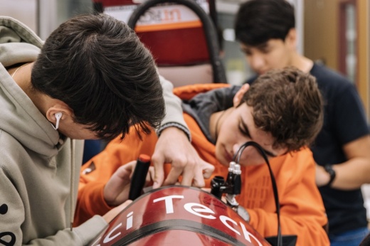 Three students working in an engineering class.