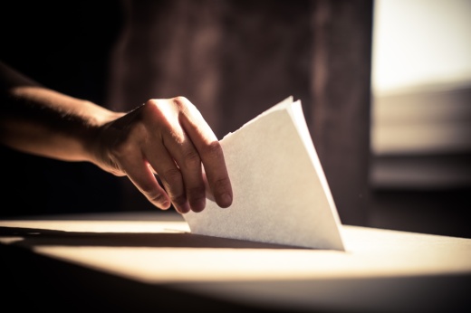 Hand placing ballot