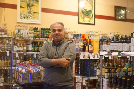 Rohit Topiwala, owner of Travis Heights Wine and Spirits, remains uncertain of the fate of his business amid the Texas Department of Transportation’s I-35 widening plan. (Katy McAfee/Community Impact)