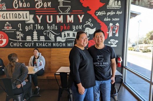 owners stand in the restaurant