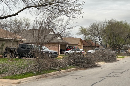 Some Round Rock residents still have brush awaiting pickup piled along their curb. (Brooke Sjoberg/Community Impact)