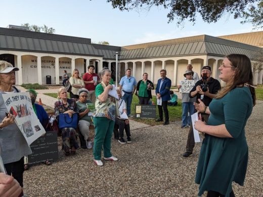 Danica Surman (right) speaks to a group of protesters ahead of a League City City Council meeting Feb. 28. City Council voted in favor of an ordinance to establish a new committee to review books flagged as inappropriate by residents. (Jake Magee/Community Impact)