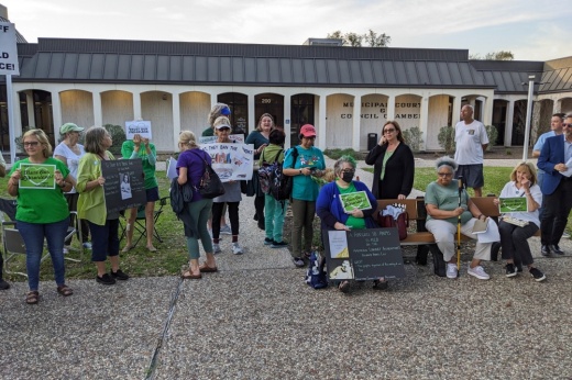 Protesters gathered outside the League City City Council Chambers on Feb. 28 to voice opposition to an ordinance establishing a new committee responsible for reviewing Helen Hall Library books deemed as offensive. (Jake Magee/Community Impact)