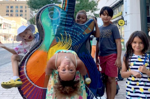children play in downtown austin